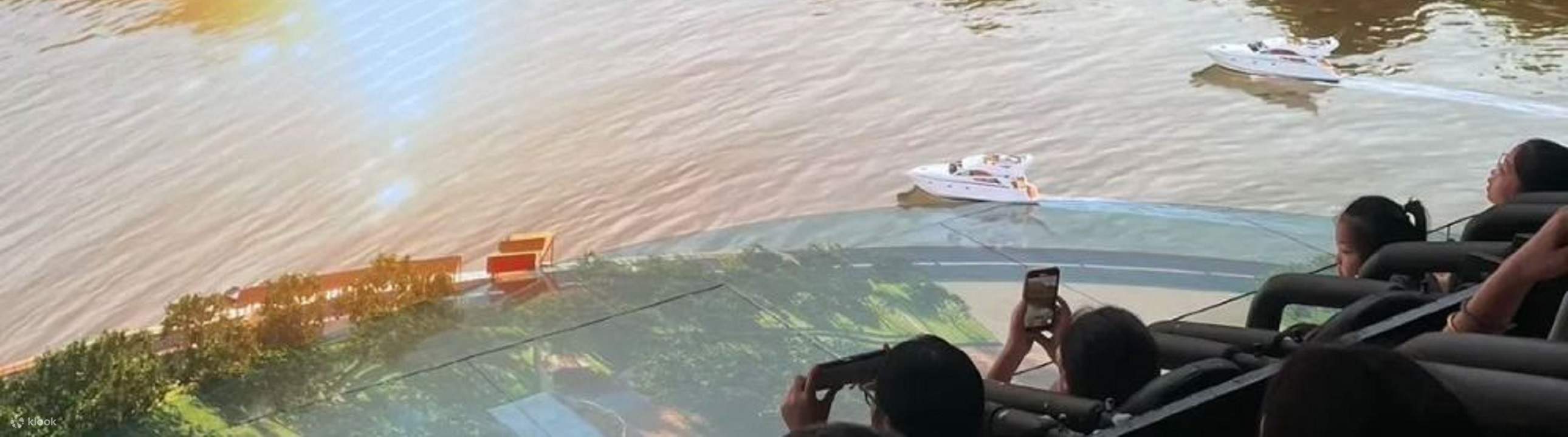 The mountains are covered with ochre-colored textures, and two speedboats are breaking through the waves.